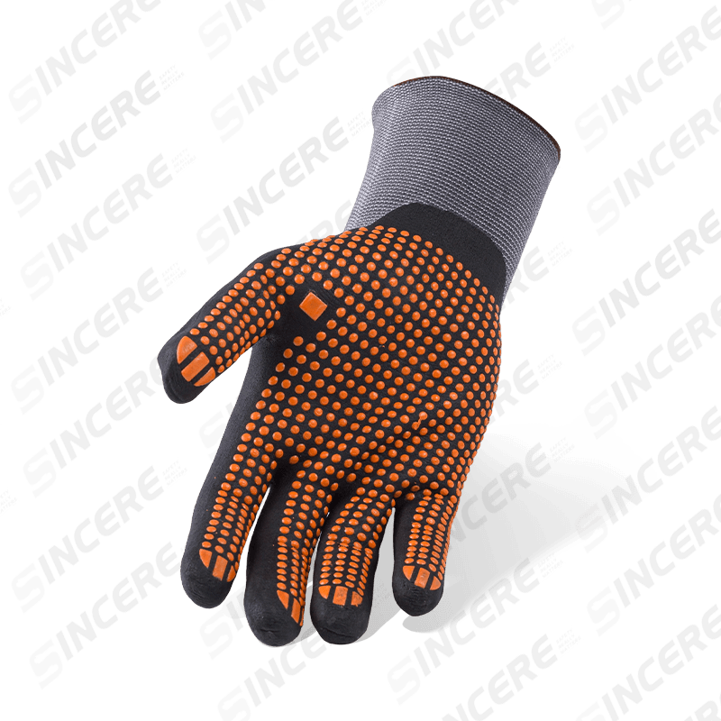 Gants en nylon élasthanne calibre 15 avec paume en micro-mousse de nitrile noir et poignée antidérapante à pois en PVC orange